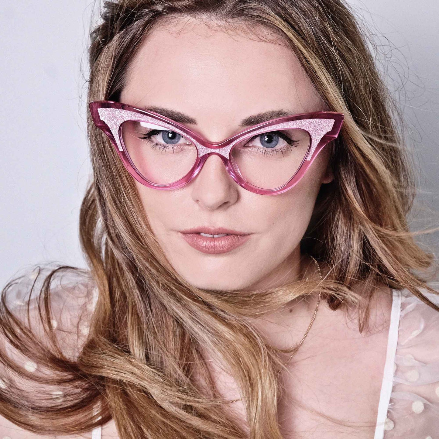Women wearing pink cateye glitter glasses frame