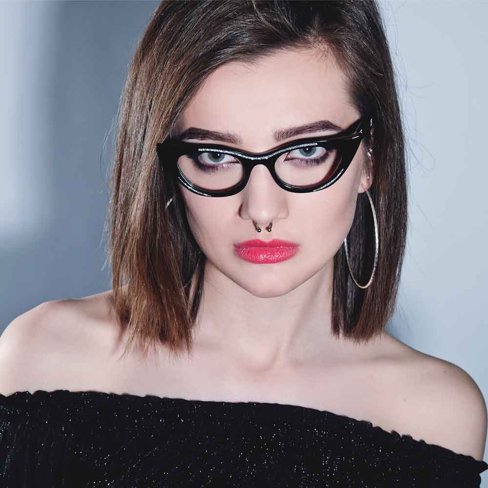 Women wearing black cat eye glasses