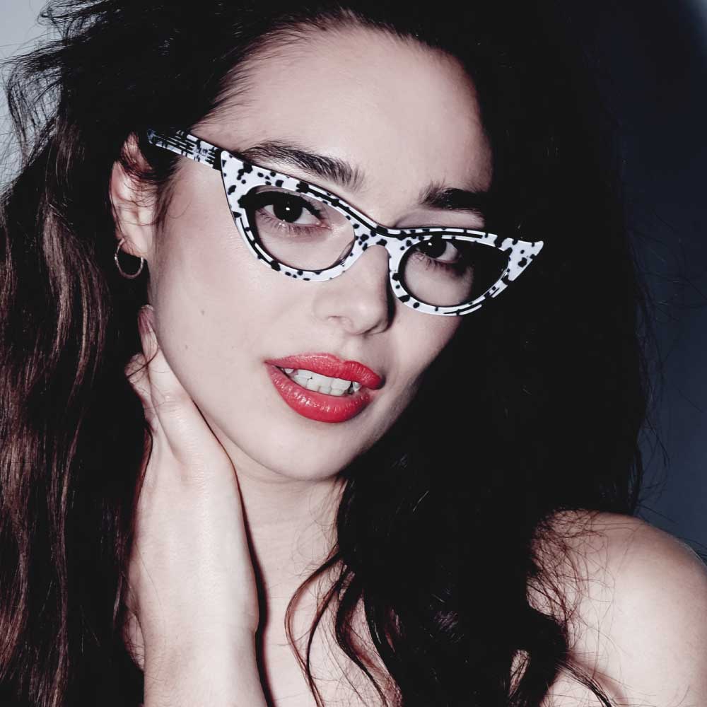 Women wearing dalmation print cat eye glasses frames