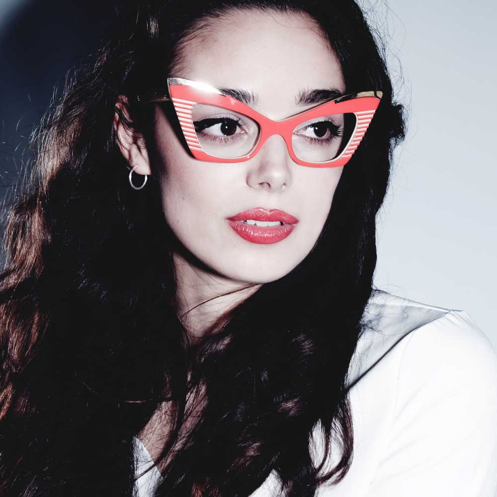 Women wearing red cat eye glasses