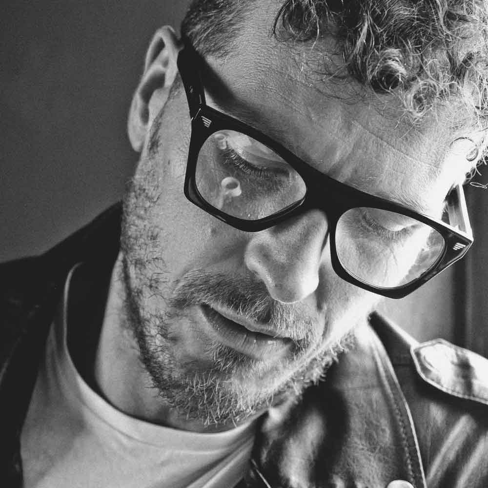 Man wearing cat eye glasses frames