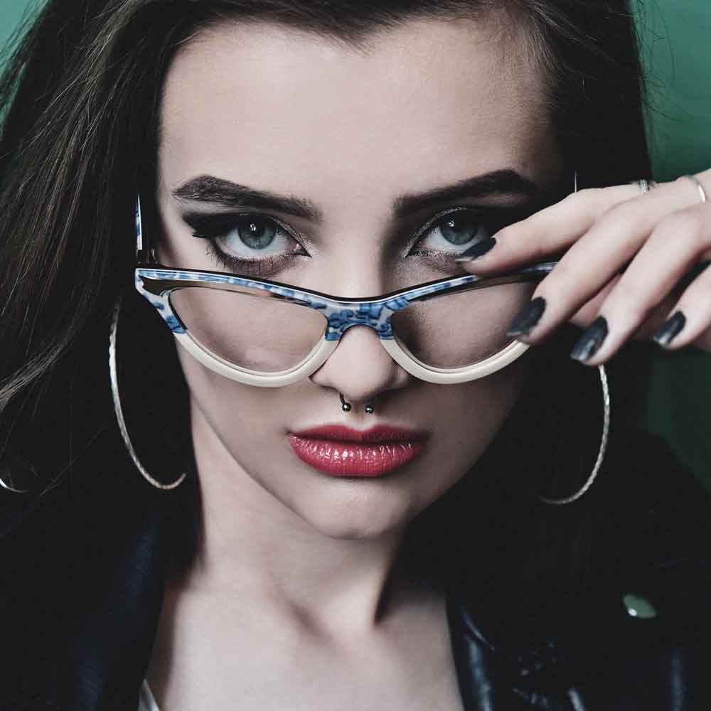 Model wearing blur & creme cat eye glasses